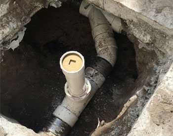 Excavated Concrete with Sewer Pipe Repair in Tampa