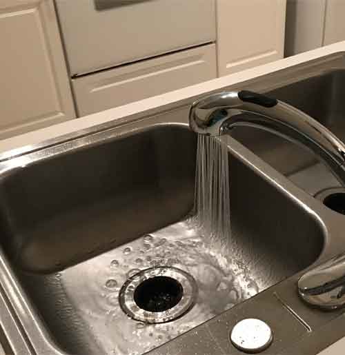 Stainless Steel Sink With Faucet Running