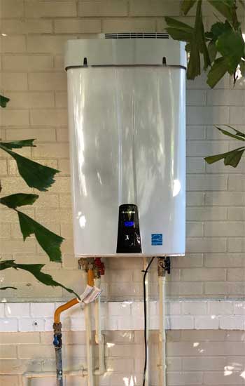 Tankless Gas Water Heater Mounted on Outside Wall