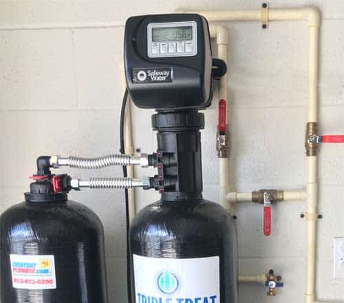 Dual tank Water Filtration system installed in garage with CPVC pipes and brass shut off valves