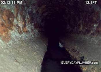 View inside cast iron sewer pipe with video drain camera