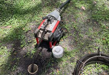 Rigid K-60 Drain Cleaning Machine at Sewer Clean Out in Yard