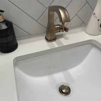Brushed Nickel Single Handle Bathroom Faucet with Matching Pop up in white Porcelain Sink