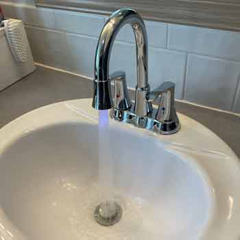 Chrome 2 handle goose neck bathroom faucet and white porcelain sink