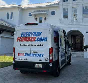 EVERYDAYPLUMBER.com van in a driveway in front of a house in Belleair, FL