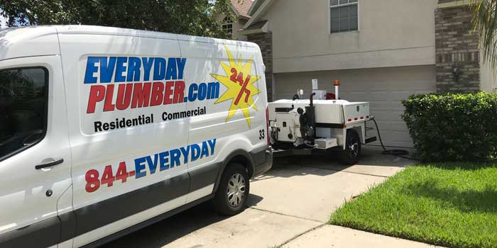 Emergency Plumbing Van in front of a house in Tampa