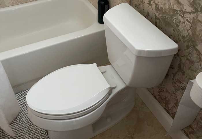 White Porcelain Toilet installation in home in St. Petersburg, FL