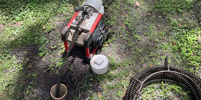 Indian Rocks Beach Plumber - Drain Cleaning Machine with a cable in a clean-out