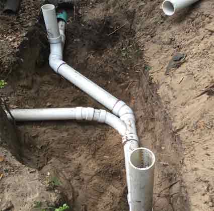 New PVC Sewer Lines in a trench prior to back filling.