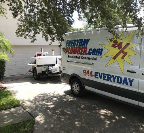 EVERYDAYPLUMBER.com plumbing van with hydro-jetting machine in front of a home in Tampa, FL