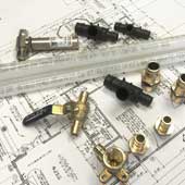 Pex-A tubing, fittings, and valves for re-piping a home laying on a blueprint for a home in Clearwater, FL