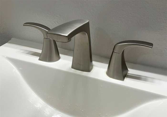 Brushed chrome modern bathroom faucet installed in a home in Lutz, FL