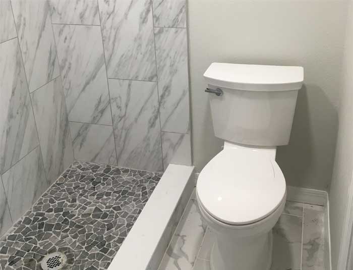 White porcelain toilet installed in a bathroom in South Tampa