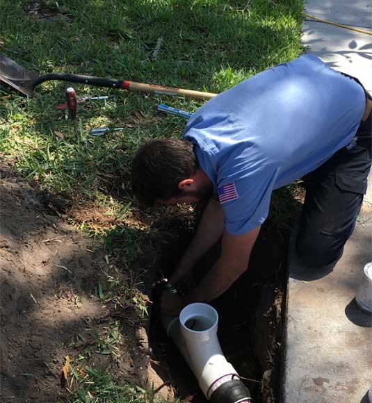 Plumber performing a sewer repair in Temple Terrace
