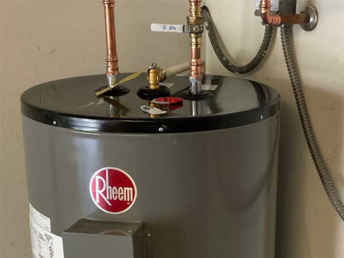 Electric Rheem water heater installed in a Tampa home.