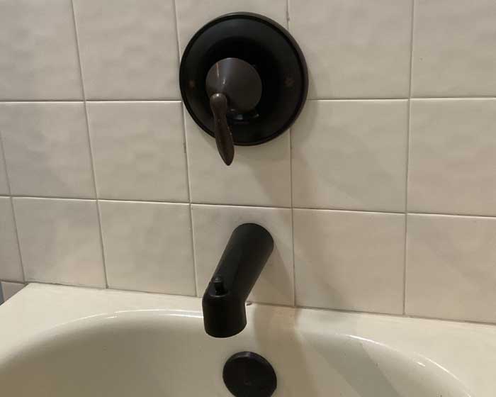 Brushed bronze Moen brand tub and shower valve installation in Tampa