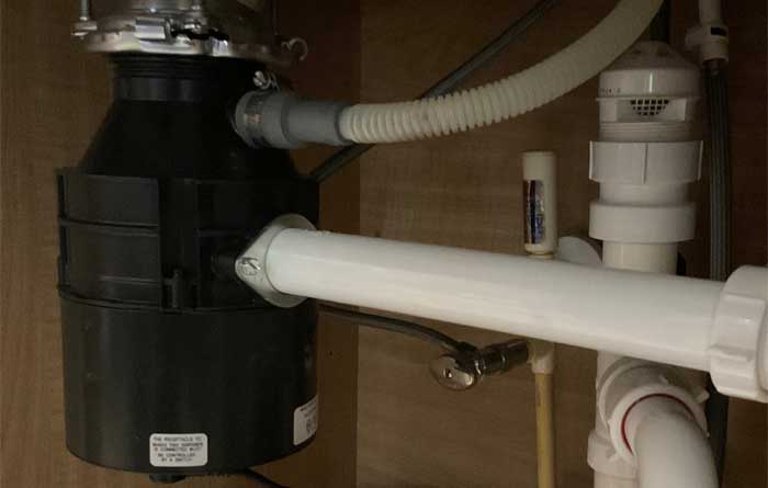 Tampa Garbage Disposal Installation and Repair Insinkerator Badger 5 garbage disposal installed under a kitchen sink in a Tampa home