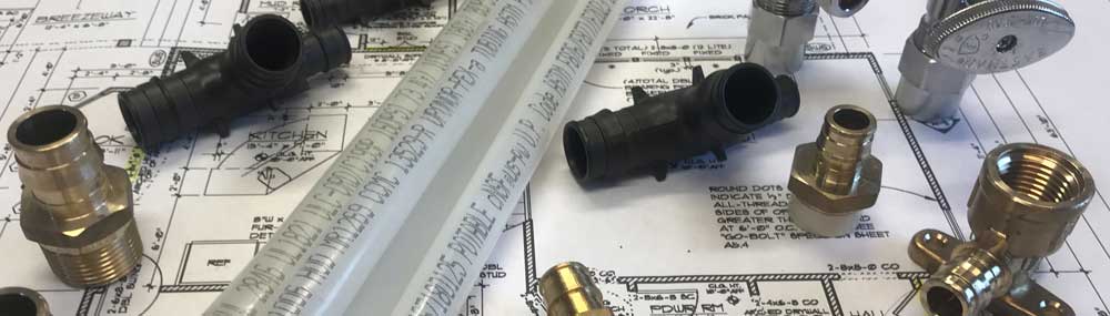 Plumbing fixtures and water pipes on plans for a residential home.
