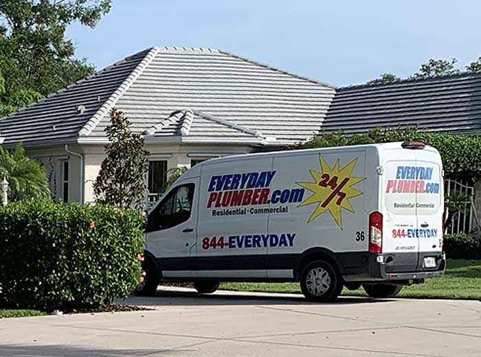EVERYDAYPLUMBER.com service van in the driveway of a residential home in Tampa, FL