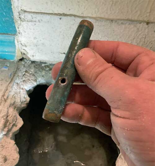 Hidden water leak in a copper pipe under the slab of a tampa home