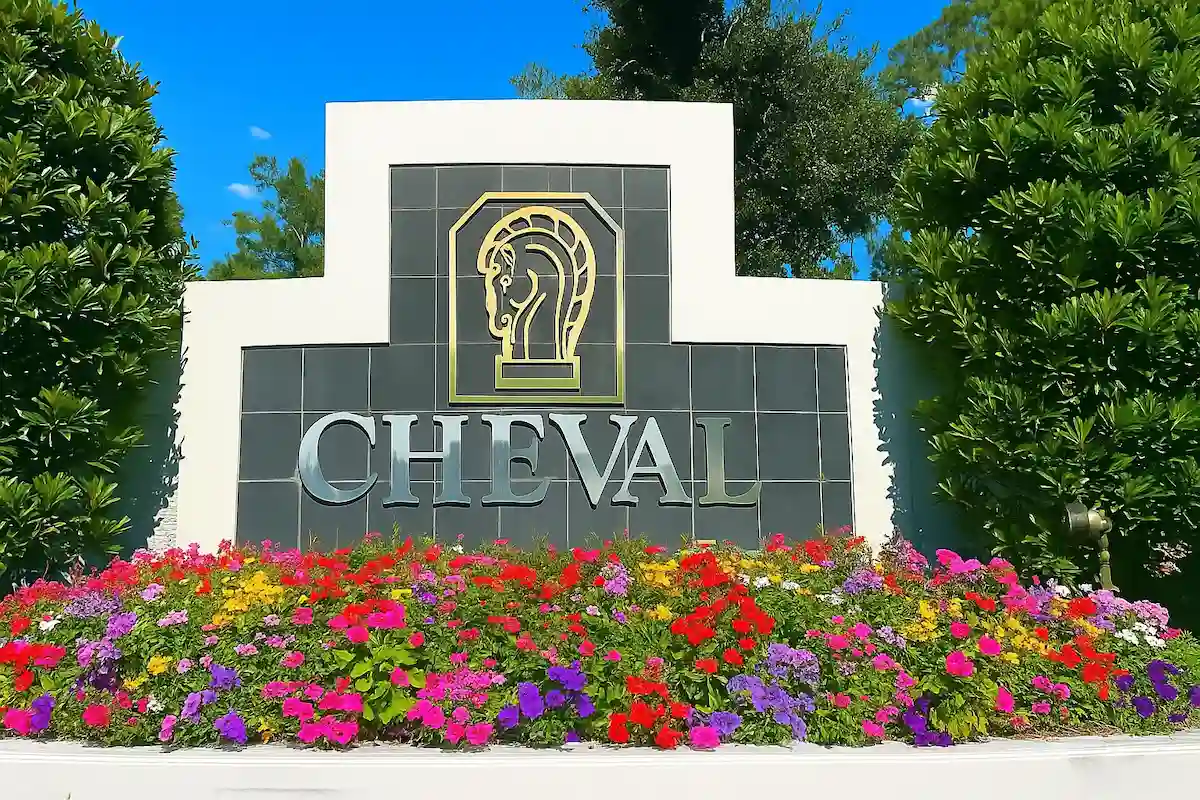 Cheval Gate_LP, RFS Cheval community entrance sign surrounded by vibrant landscaping and flowers in Lutz, Florida.