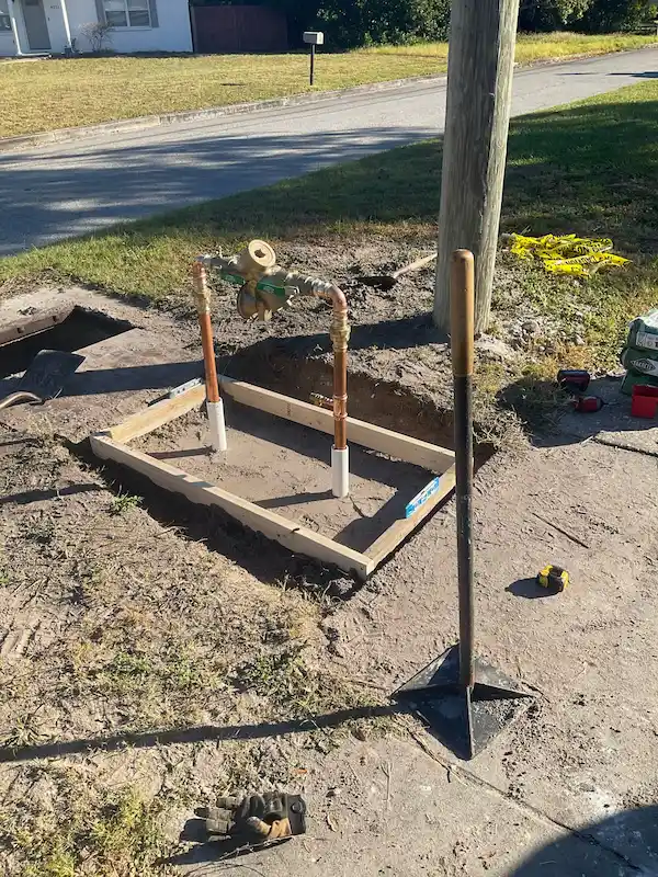 New backflow preventer installed outdoors by a Hillsborough County plumber, ready for inspection.