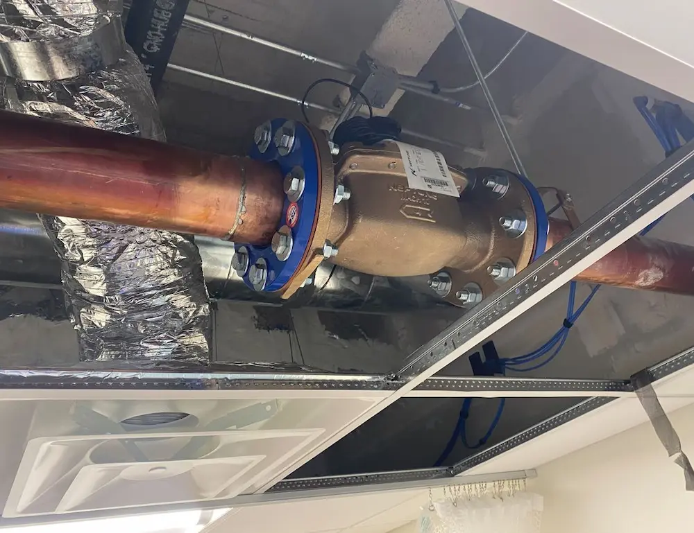 New commercial copper piping installed above ceiling by a Hillsborough County plumber.