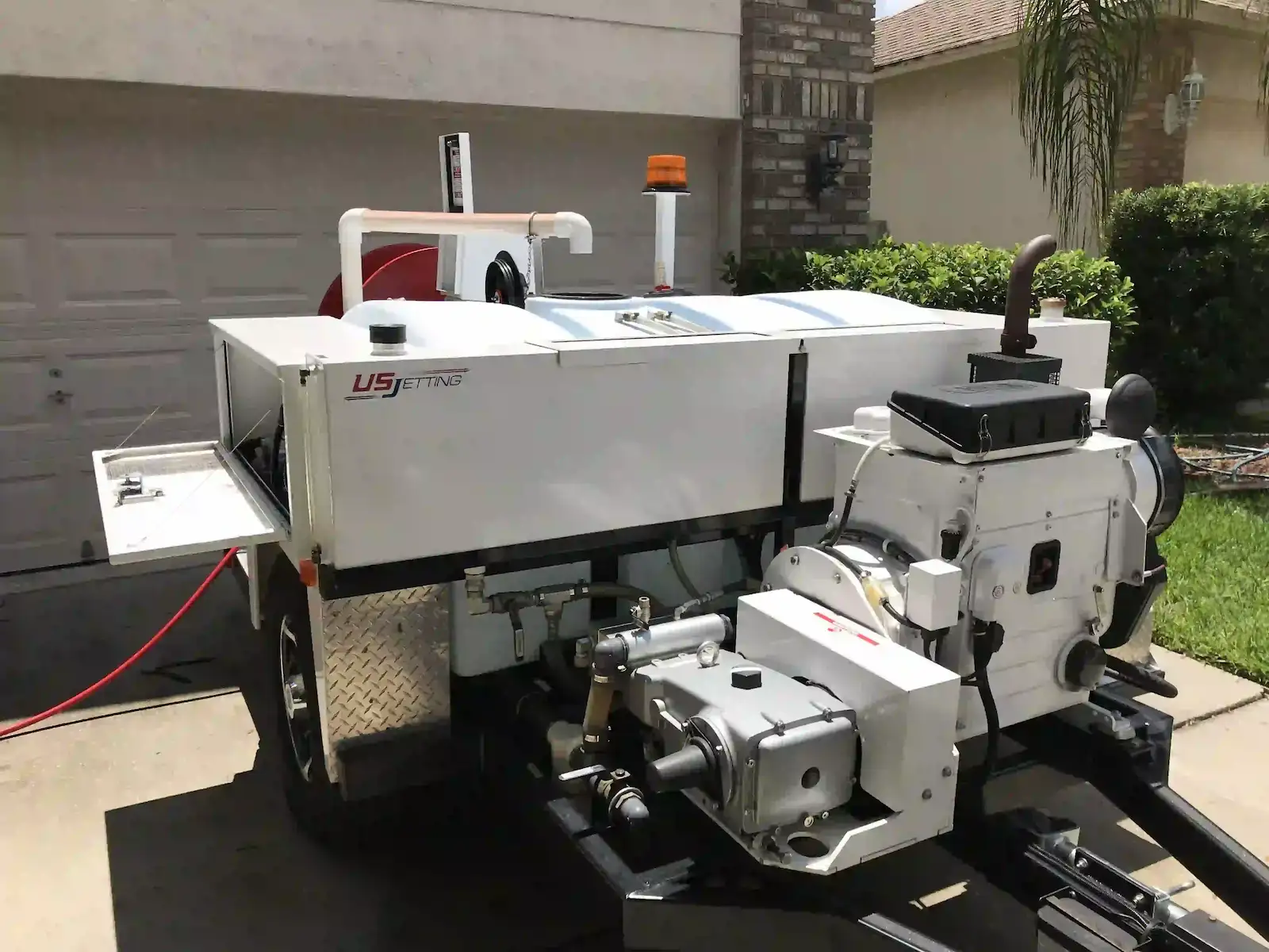Commercial hydro jetting machine that can be used to eliminate drain fly breeding grounds in clogged sewer lines