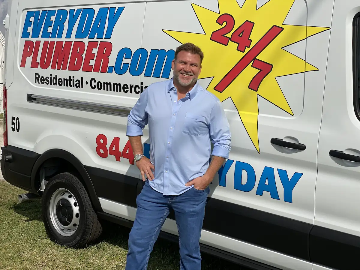 Mike Haisten, founder of EVERYDAYPLUMBER.com, standing beside a branded service van representing leadership and plumbing careers in Tampa.