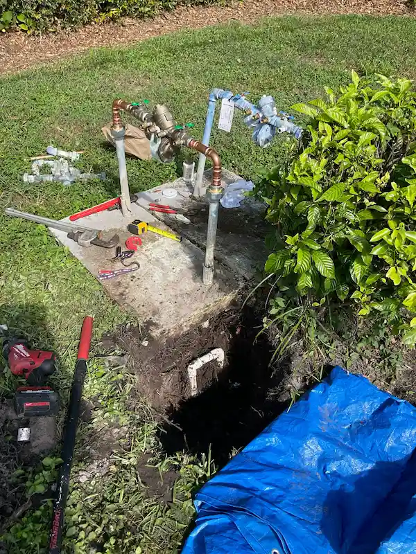 Backflow preventer for an irrigation system rebuilt and tested, new shutoff valves and copper fittings installed with excavation at the service line in Cheval, FL.