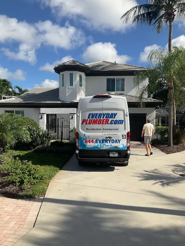 Clean and clearly branded EVERYDAYPLUMBER.com service van parked in residential driveway in Tampa, Florida.