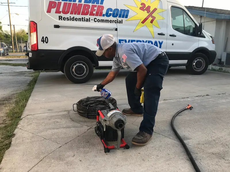 EVERYDAYPLUMBER.com plumber cleaning and caring for drain cleaning equipment to ensure professional service