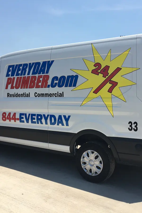 EVERYDAYPLUMBER.com service van with bold 24/7 logo, advertising residential and commercial plumbing services and the phone number 844-EVERYDAY, showcasing around-the-clock availability.