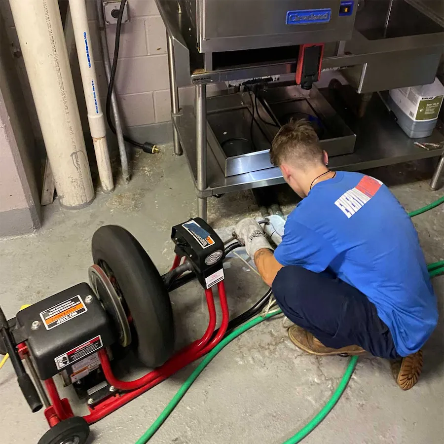 EVERYDAYPLUMBER.com technician performing drain cleaning in a Tampa commercial kitchen