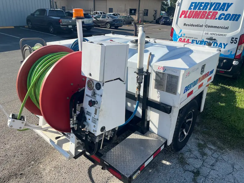 Hydro jetting trailer with hose reel and water tank used by St. Petersburg plumbers at EVERYDAYPLUMBER.com