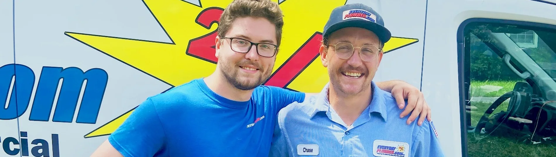 EVERYDAYPLUMBER.com Tampa plumbers smiling beside company van highlighting friendly 24/7 plumbing service