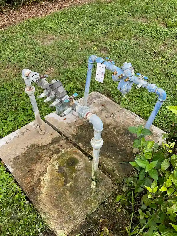 Outdoor backflow preventer assembly on service lines, used for backflow testing and repair in Ybor City