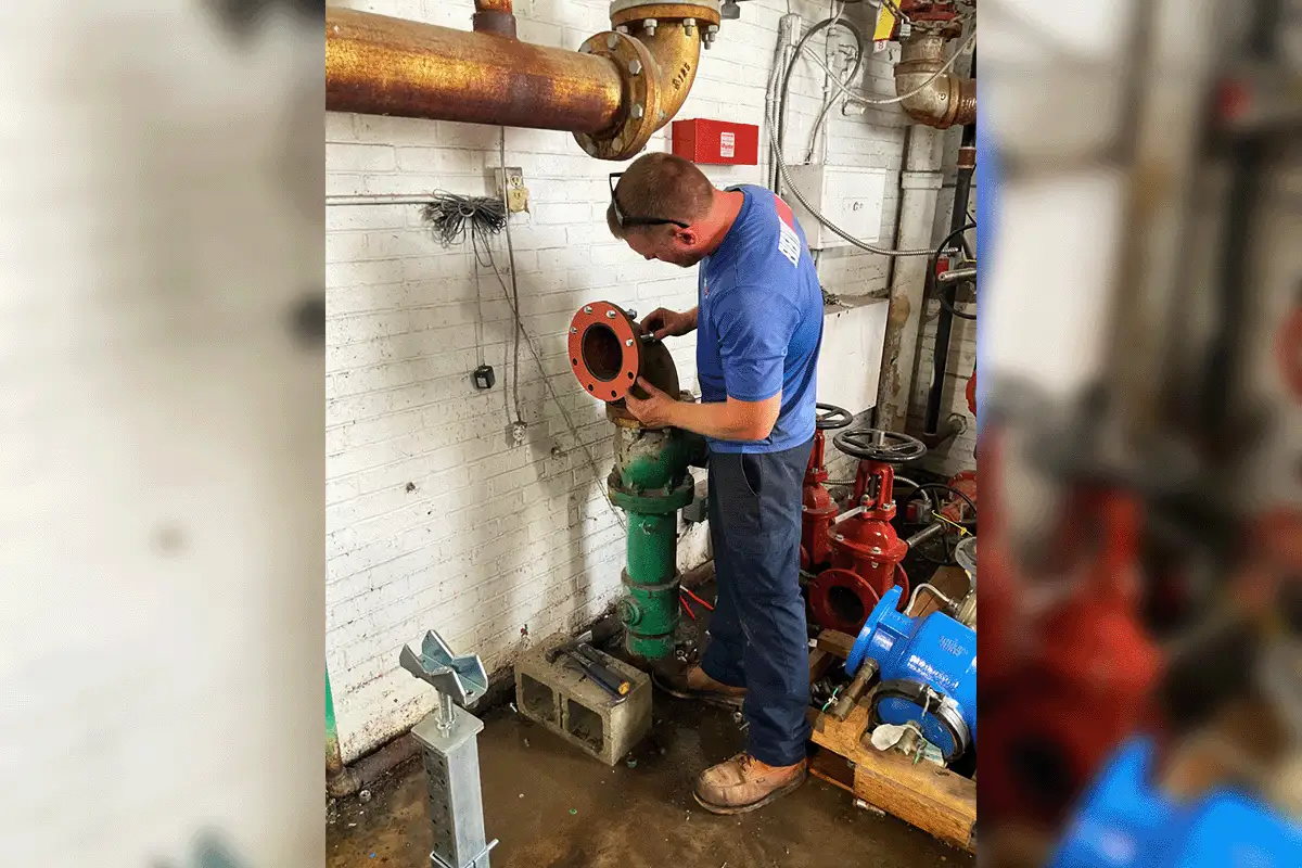 EverydayPlumber.com licensed plumber repairing commercial pipe valves in a flooded utility room on a Tampa Bay commercial property