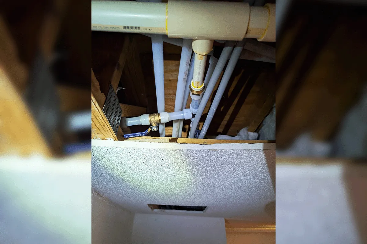 New PEX and CPVC supply lines with brass shutoff valve installed in an attic during a whole house repipe by EverydayPlumber.com in Tampa Bay