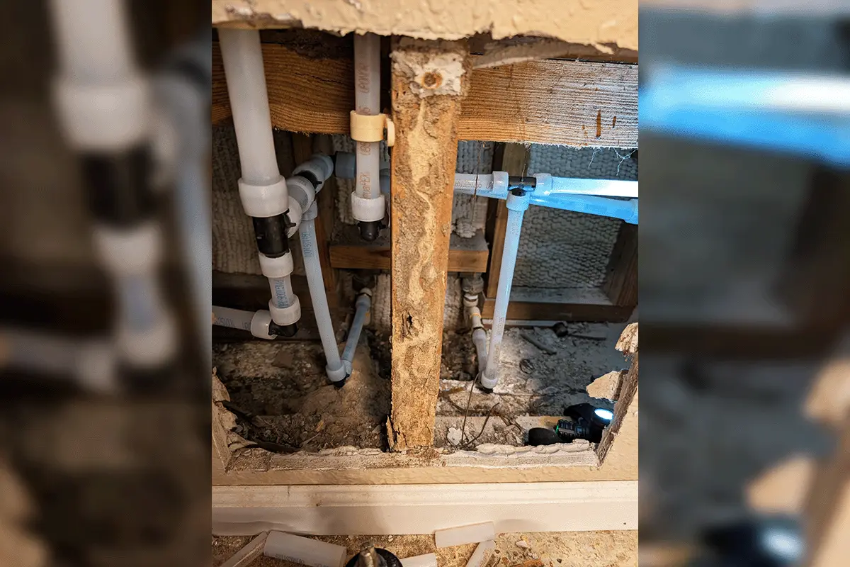 New PEX supply lines routed through floor joists and wall framing during a whole house repipe by EverydayPlumber.com in Tampa Bay