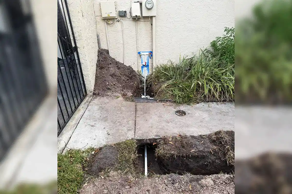New water main supply line installed through exterior wall trench connection during a whole house repipe by EverydayPlumber.com at a Tampa Bay residence