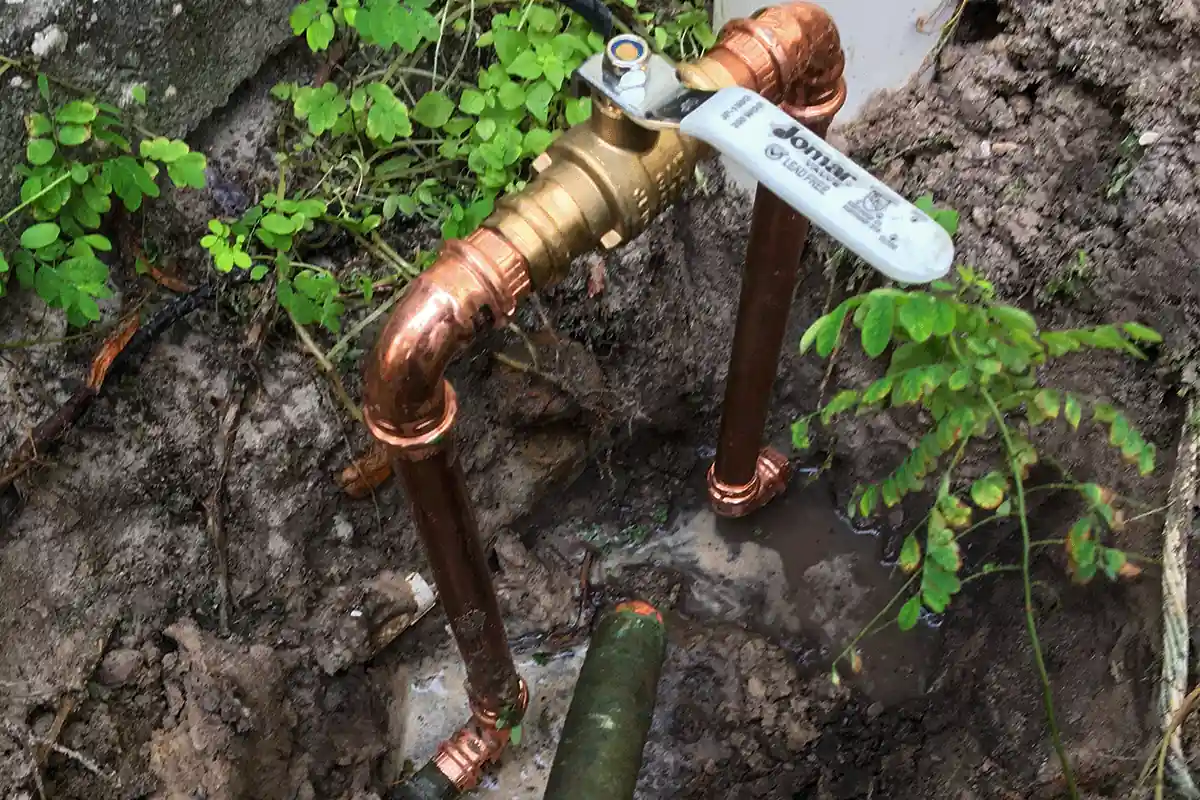 Copper water line repair with Jomar brass ball valve shutoff in residential yard excavation — EVERYDAYPLUMBER.com Tampa Bay