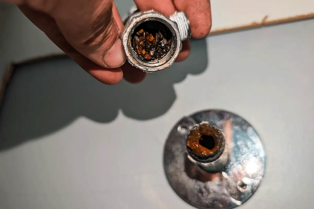 Severely corroded galvanized pipe interior showing mineral scale and rust buildup — hard water pipe deterioration — EVERYDAYPLUMBER.com Tampa Bay