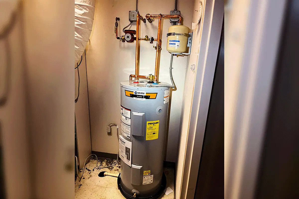 State ProLine water heater installed in utility closet with copper piping and expansion tank — water heater installation Tampa