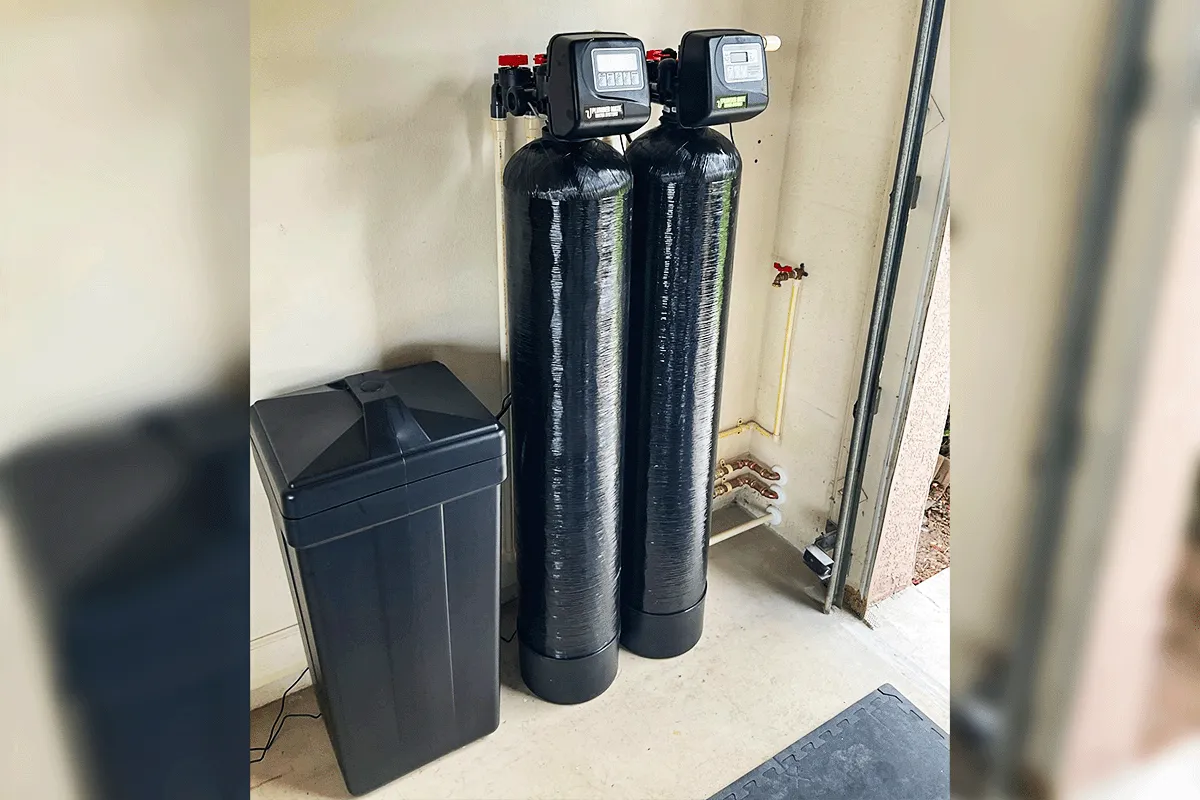Dual-tank water softener system with brine tank installed in Tampa home garage