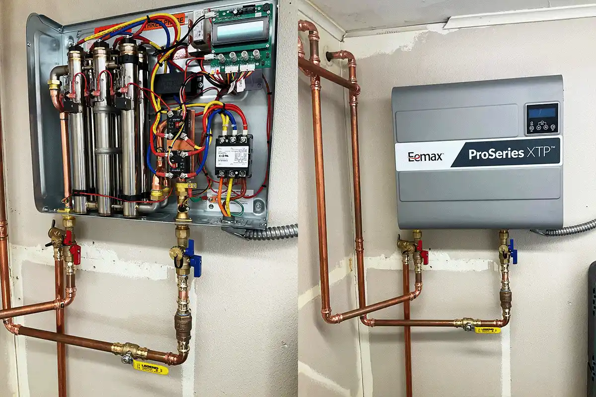 Eemax ProSeries XTP commercial-grade electric tankless water heater installation in Tampa Bay — open panel showing multiple heating elements and wiring alongside the closed unit with copper supply lines and isolation valves, demonstrating professional electric tankless installation by EverydayPlumber.com