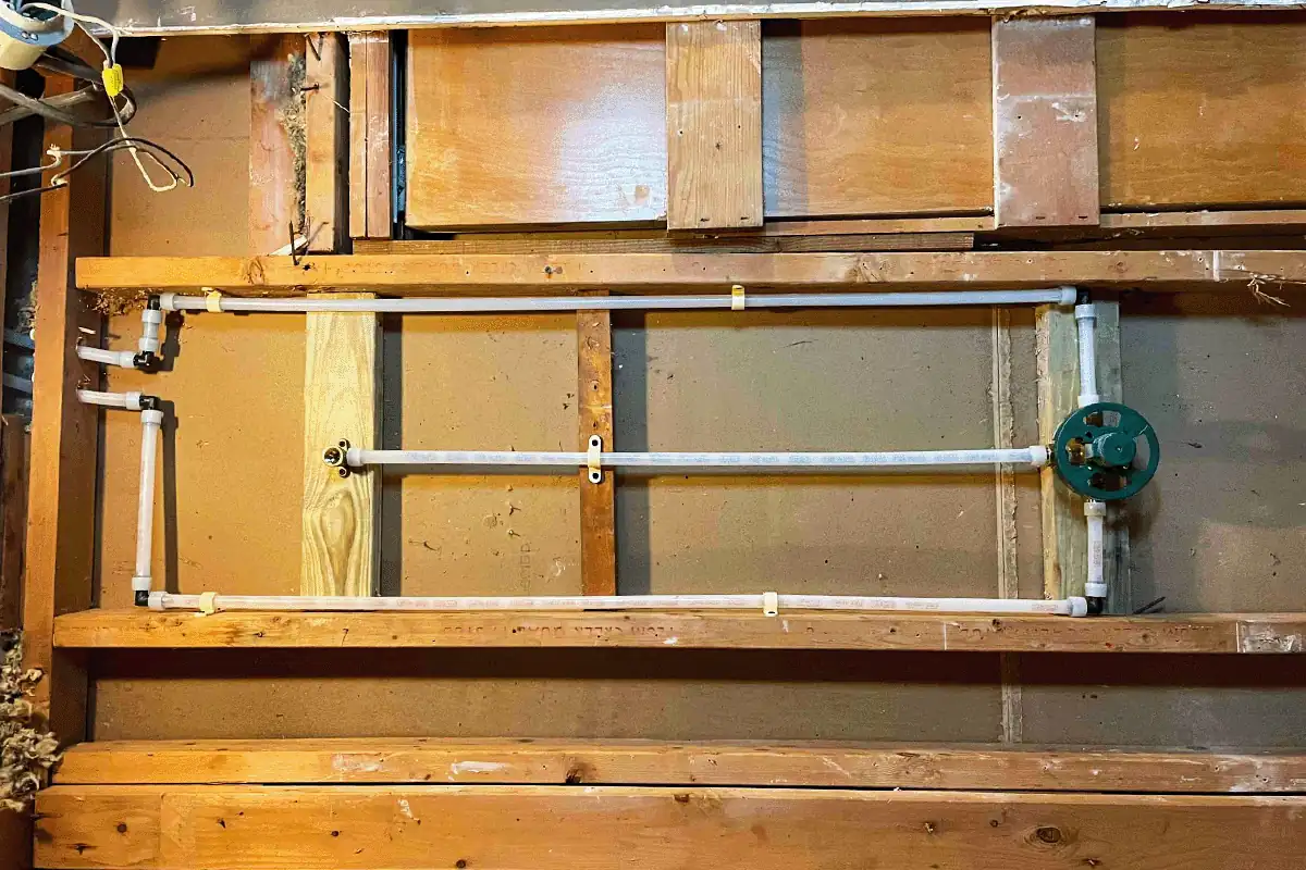PVC water supply pipes installed inside open wall framing with shut-off valve — new construction plumbing Wesley Chapel — EVERYDAYPLUMBER.com Wesley Chapel