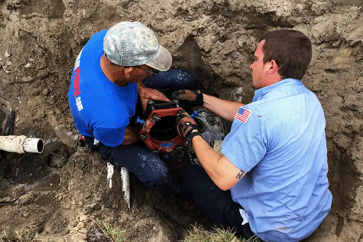 EVERYDAYPLUMBER.com technicians installing backflow part in South Tampa — EVERYDAYPLUMBER.com