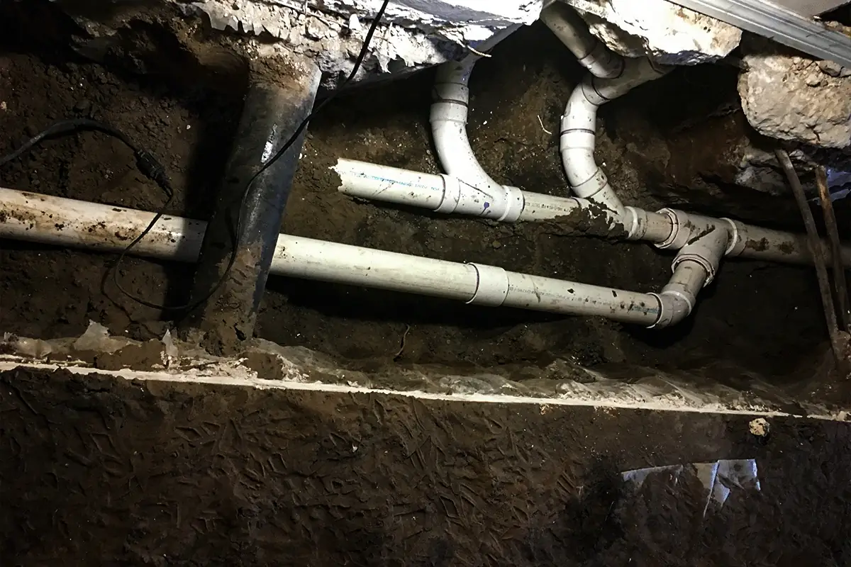 New PVC drain pipes installed beneath concrete slab during South Tampa residential plumbing repair — under-slab plumbing repair and sewer service in South Tampa — EVERYDAYPLUMBER.com