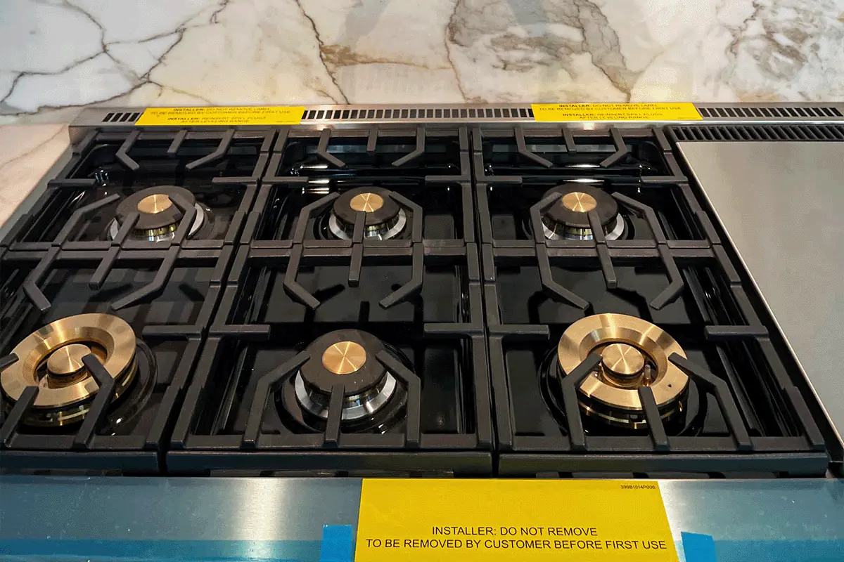 edp-commercial-gas-range-burners-2026 Commercial-style gas range with multiple burners freshly installed — commercial gas plumbing — EVERYDAYPLUMBER.com Tampa Bay